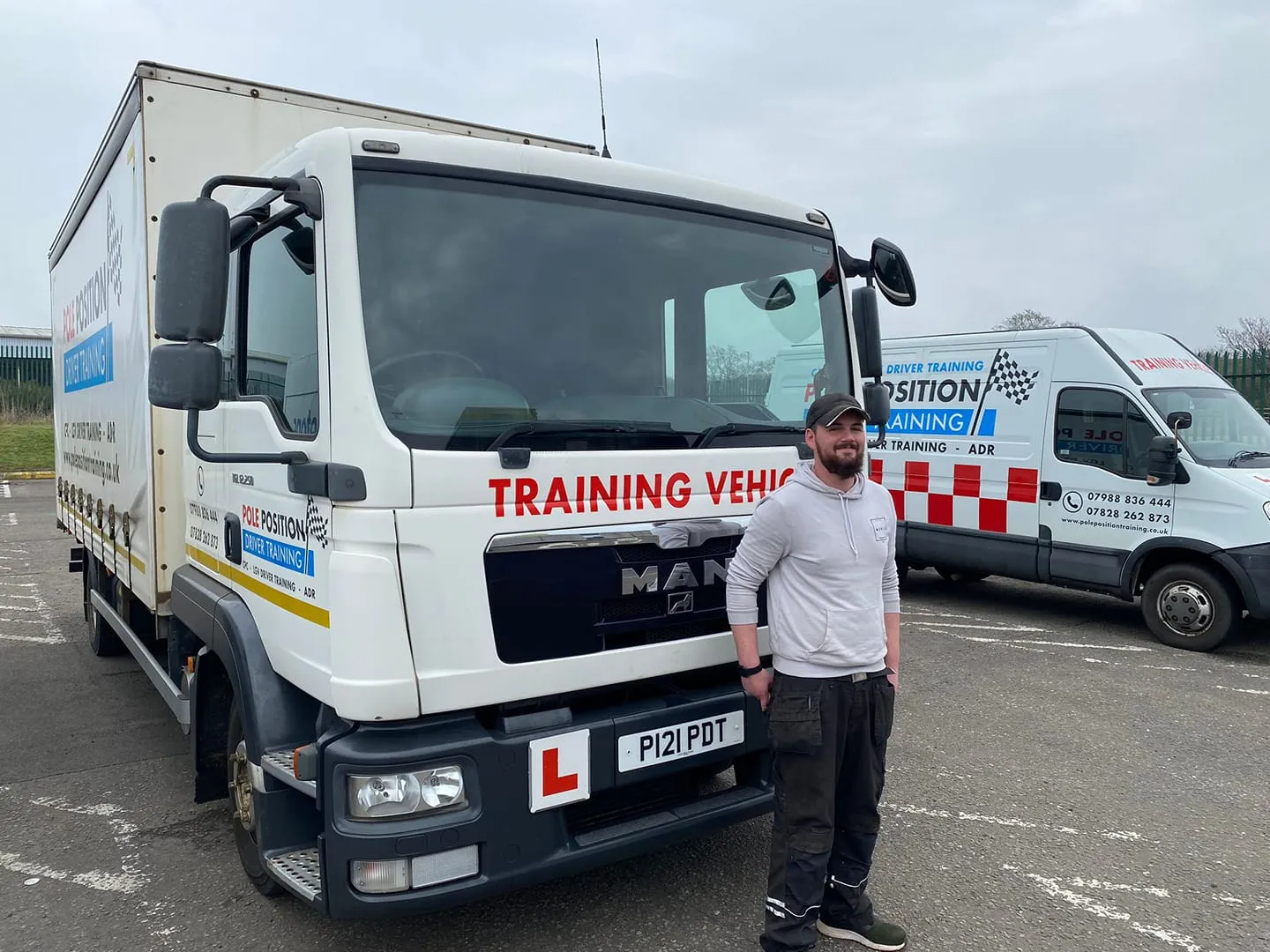 Driver beside a Pole Position rigid training lorry in Livingston West Lothian